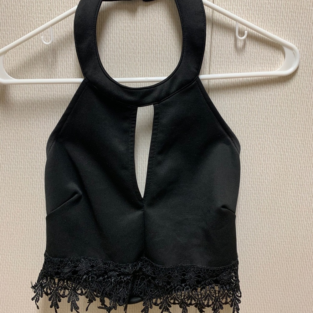 Cropped black halter top with slit